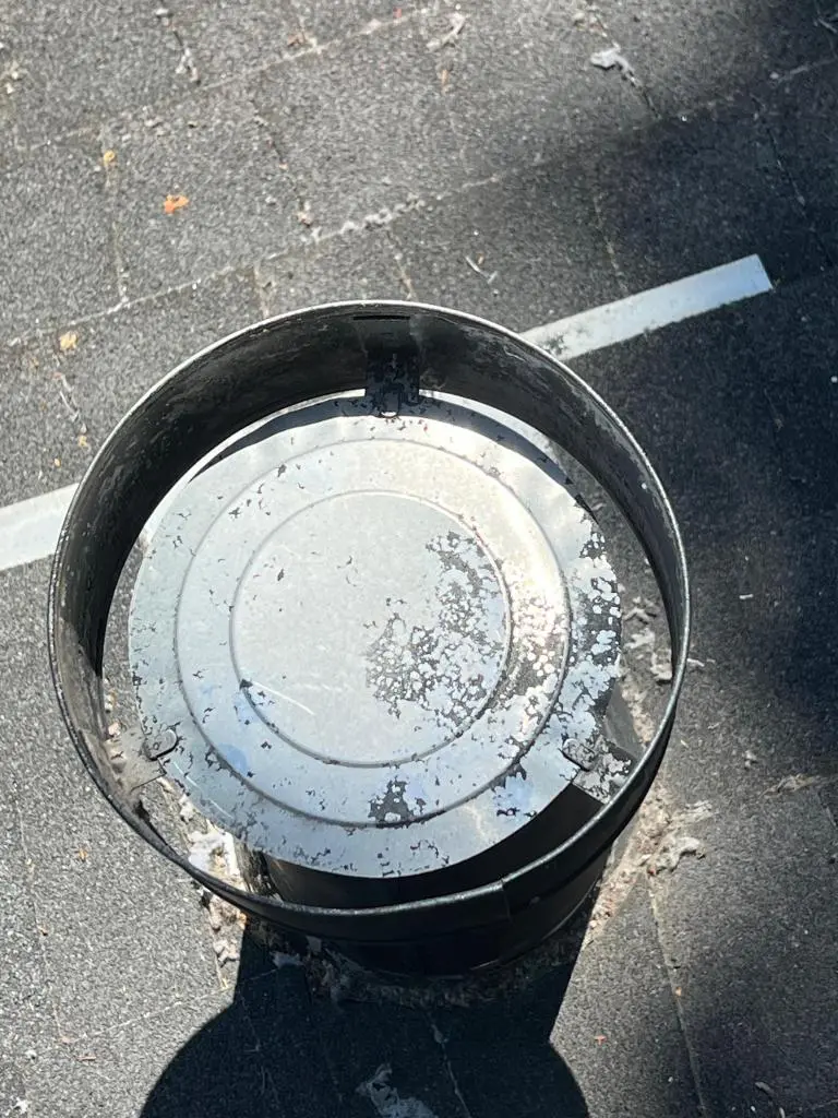 Certified technician inspecting vent system during professional Dryer Vent Cleaning service.